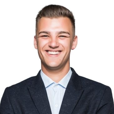 pretty-young-man-student-businessman-jacket-holds-his-arms-crossed-isolated-light-grey-wall-min